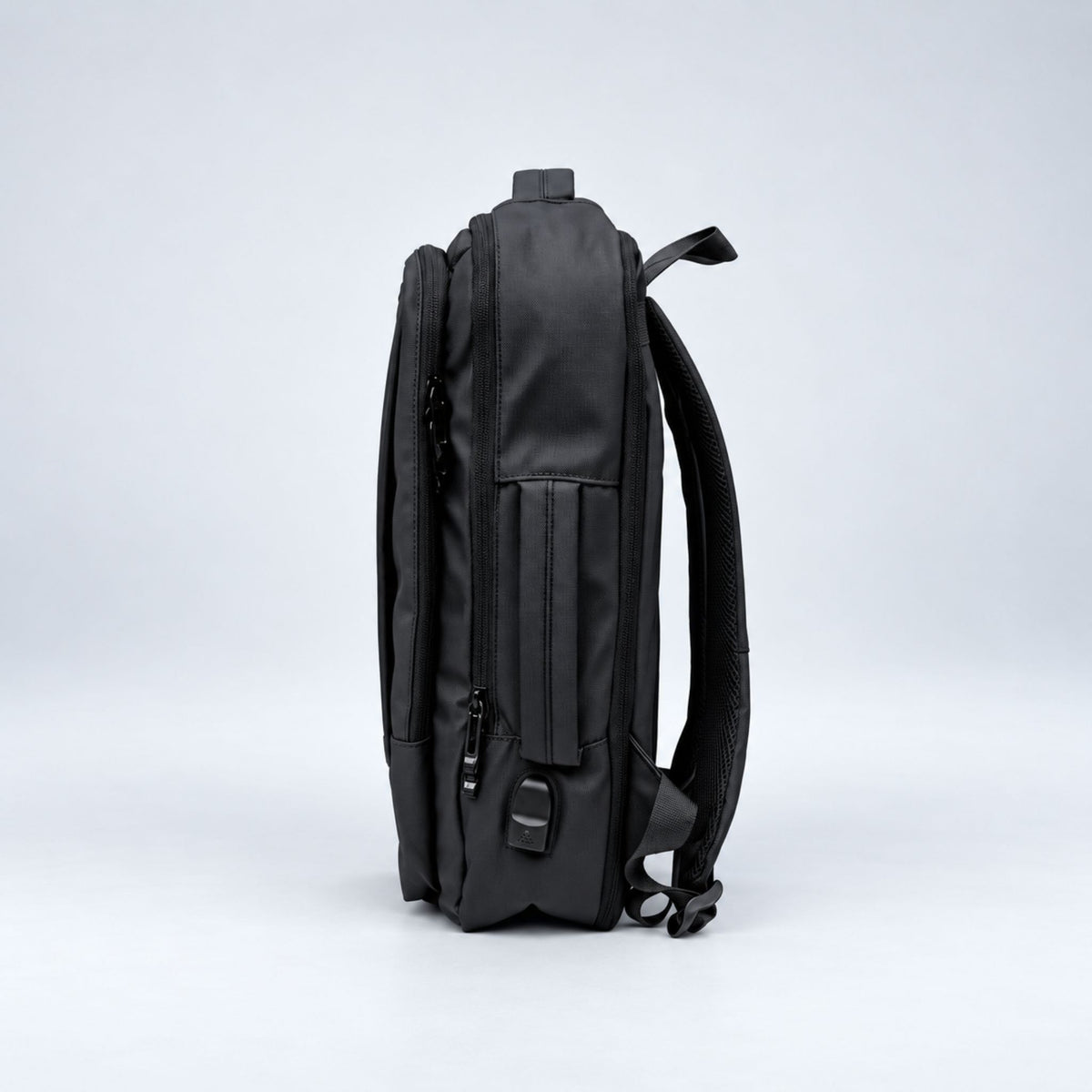 Black Commuter laptop backpack side view with USB port #Colour_Black